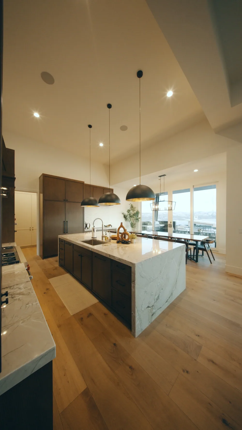 A bright kitchen with a marble island in a new home.